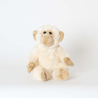 Moyen singe blanc et crème réaliste la pelucherie